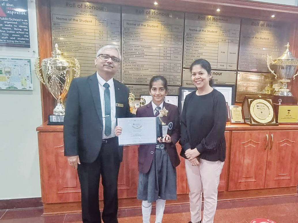 Kenisha Sood with school officials.