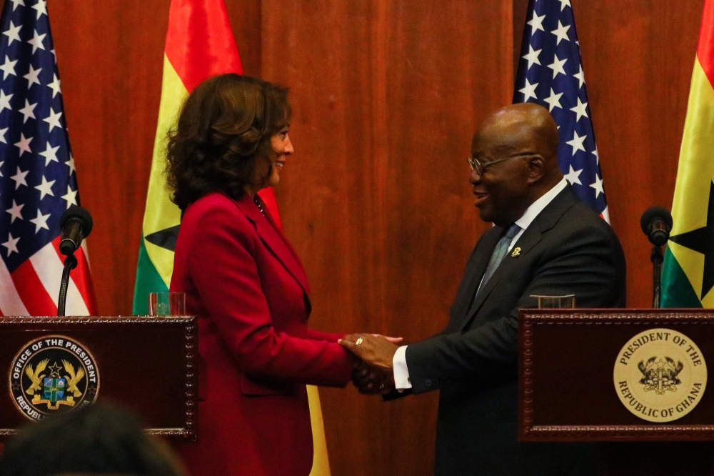 US Vice President Kamala Harris (left) shakes hands with President of Ghana Nana Akufo-Addo during a press conference after their bilateral meeting in Accra, Ghana, on March 27, 2023. (Photo by Nipah Dennis / AFP)