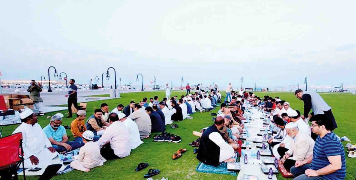 People break their fast during a community Iftar hosted by the AMUAAQ.    