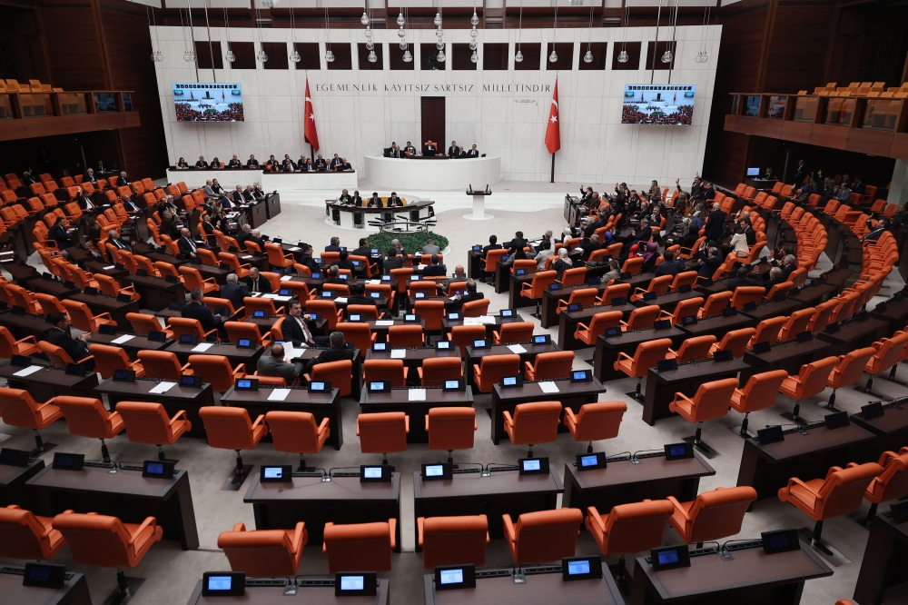 The Turkish Parliament vote to approve Finland's application to join NATO, with 276 votes, in Ankara, on March 30, 2023. (Photo by Adem Altan / AFP)