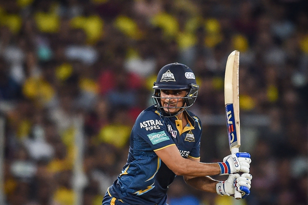 Gujarat Titans' Shubman Gill plays a shot during the Indian Premier League (IPL) Twenty20 cricket match between Gujarat Titans and Chennai Super Kings at the Narendra Modi Stadium in Ahmedabad on March 31, 2023. (Photo by Punit PARANJPE / AFP)