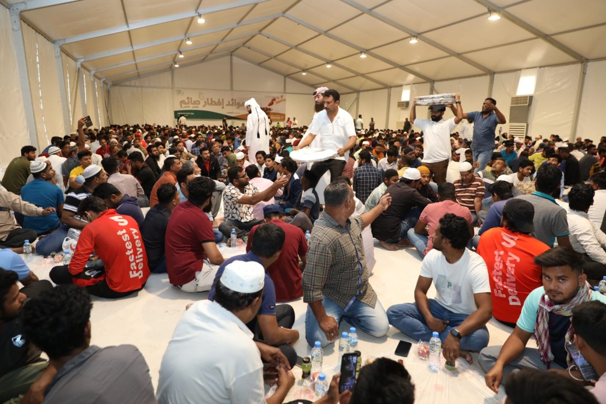People gather inside an Iftar tent set up by the Awqaf Ministry near Thursday & Friday Souq in Ain Khaled. Pic: Salim Matramkot / The Peninsula
