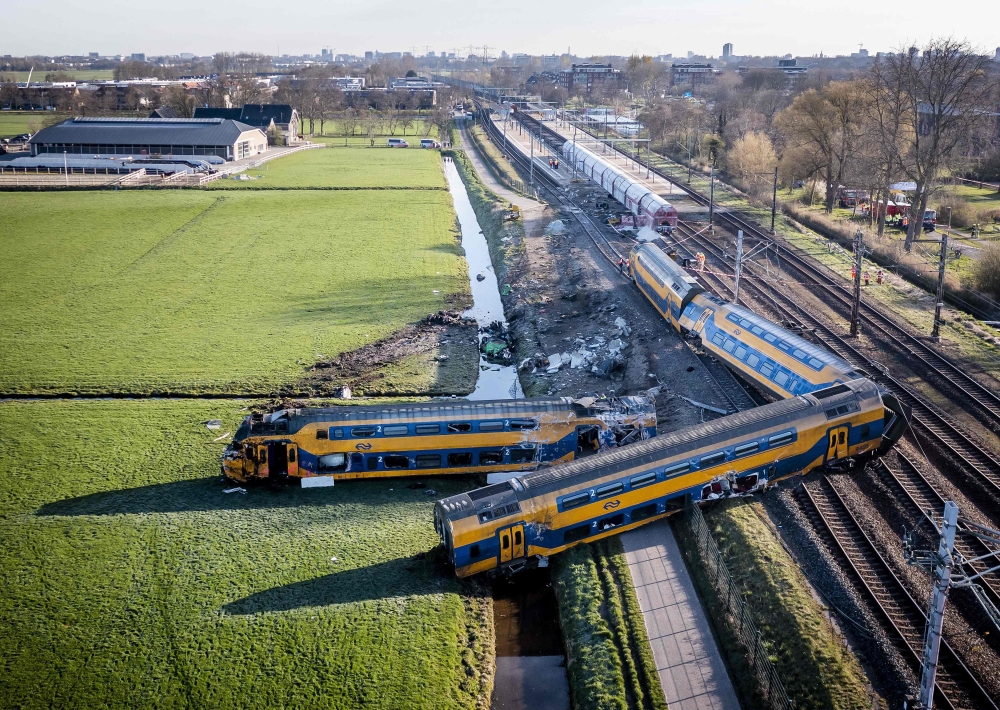 This aerial view shows a derailed night train in Voorschoten on April 4, 2023. Photo by Remko de Waal / ANP / AFP