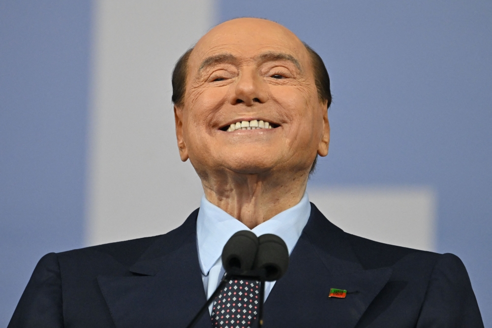 In this file photo taken on September 22, 2022, Forza Italia leader Silvio Berlusconi speaks on stage. (Photo by Alberto Pizzoli / AFP)