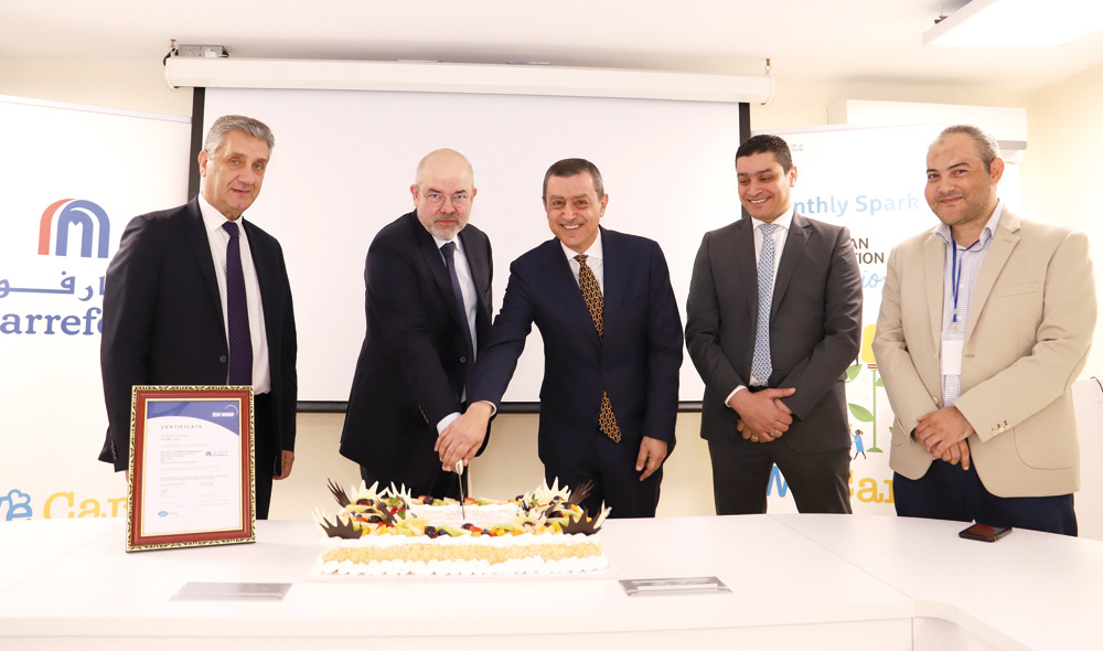 Carrefour officials after securing the certification.