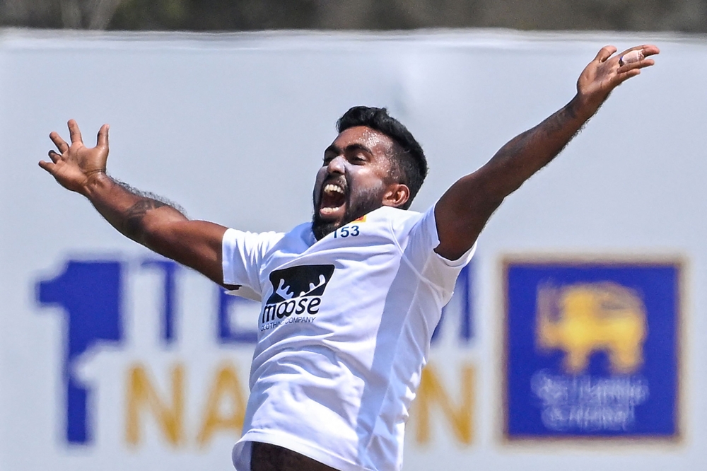 Sri Lanka's Asitha Fernando appeals unsuccessfully for a Leg Before Wicket (LBW) decision against Ireland's James McCollum (not pictured) during the second day of the first cricket Test match between Sri Lanka and Ireland at the Galle International Cricket Stadium in Galle on April 17, 2023. (Photo by Ishara S. Kodikara/ AFP)