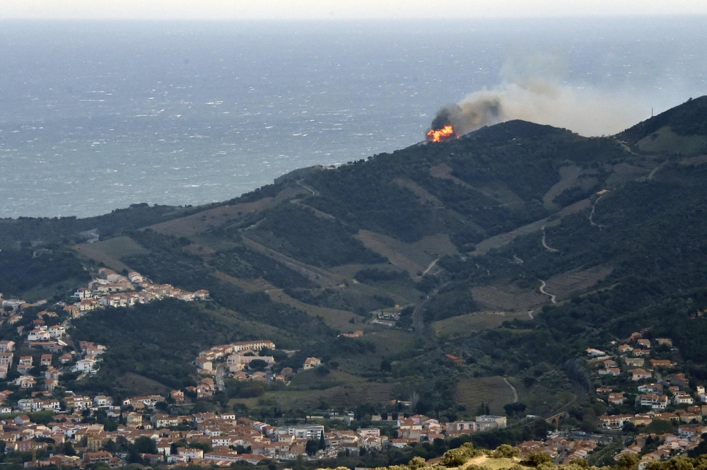 A forest fire burns on a hill overlooking the village of Banyuls-sur-Mer, southwestern France on April 16, 2023. Photo by RAYMOND ROIG / AFP