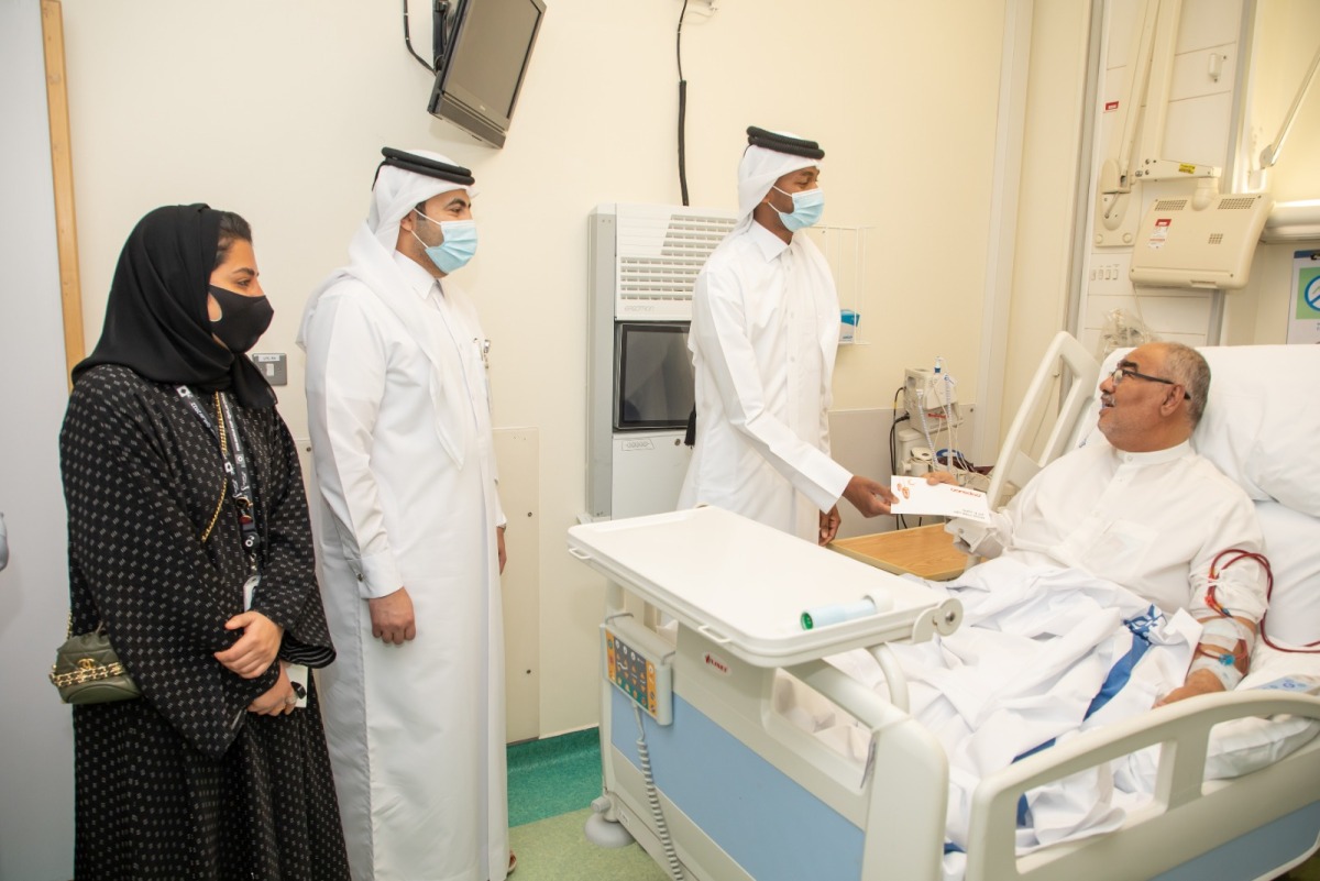 Ooredoo officials with a patient during the visit to the centre.