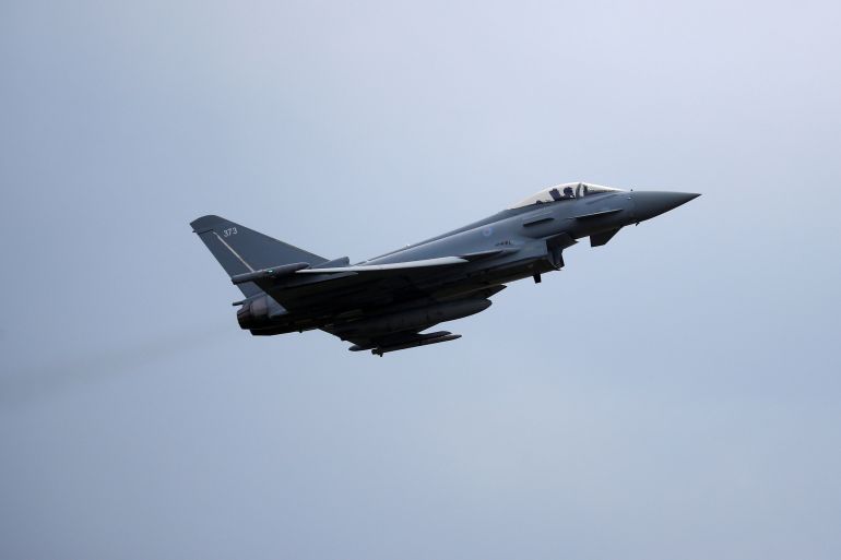 A Typhoon jet takes off from the RAF's Coningsby base in Lincolnshire, the UK, in 2018 [File: Phil Noble/pool/AFP]
