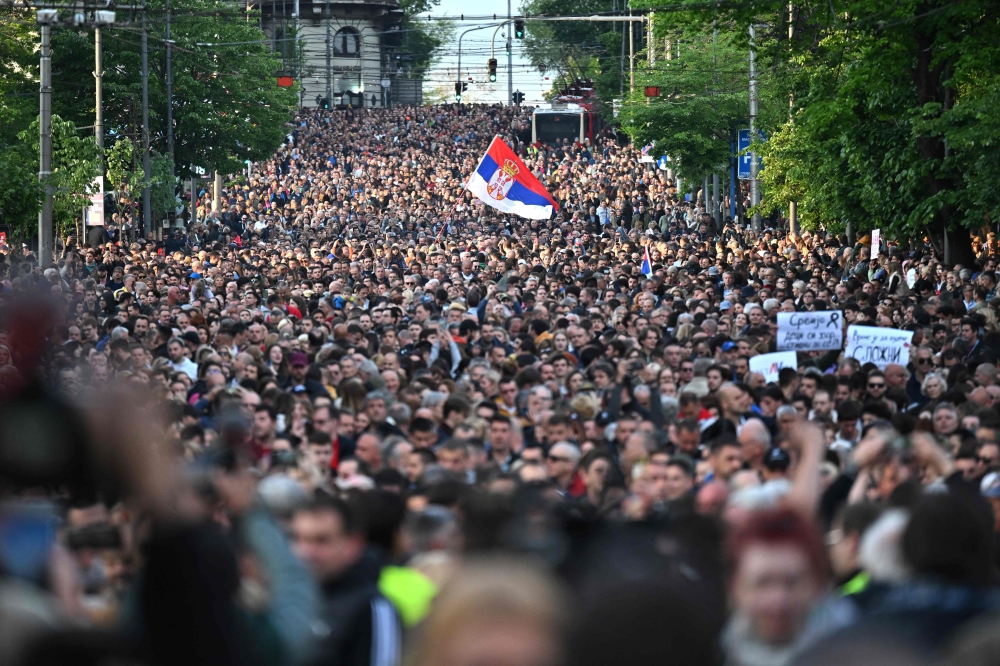 Demonstrators march during a rally to call for the resignation of top officials and the curtailing of violence in the media, just days after back-to-back shootings stunned the Balkan country, in Belgrade on May 8, 2023. (Photo by ANDREJ ISAKOVIC / AFP)