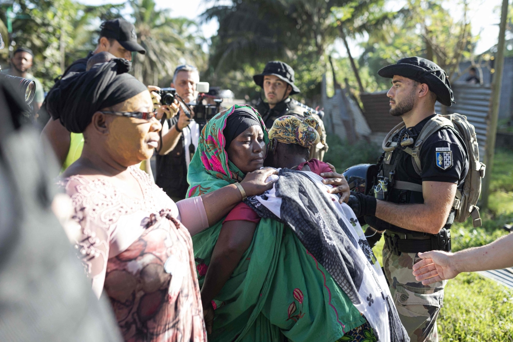 File photo: People react during the demolition of an informal settlement in Langoni, Mamoudzou, on the island of Mayotte on April 27, 2023. (Photo by Patrick Meinhardt / AFP)

