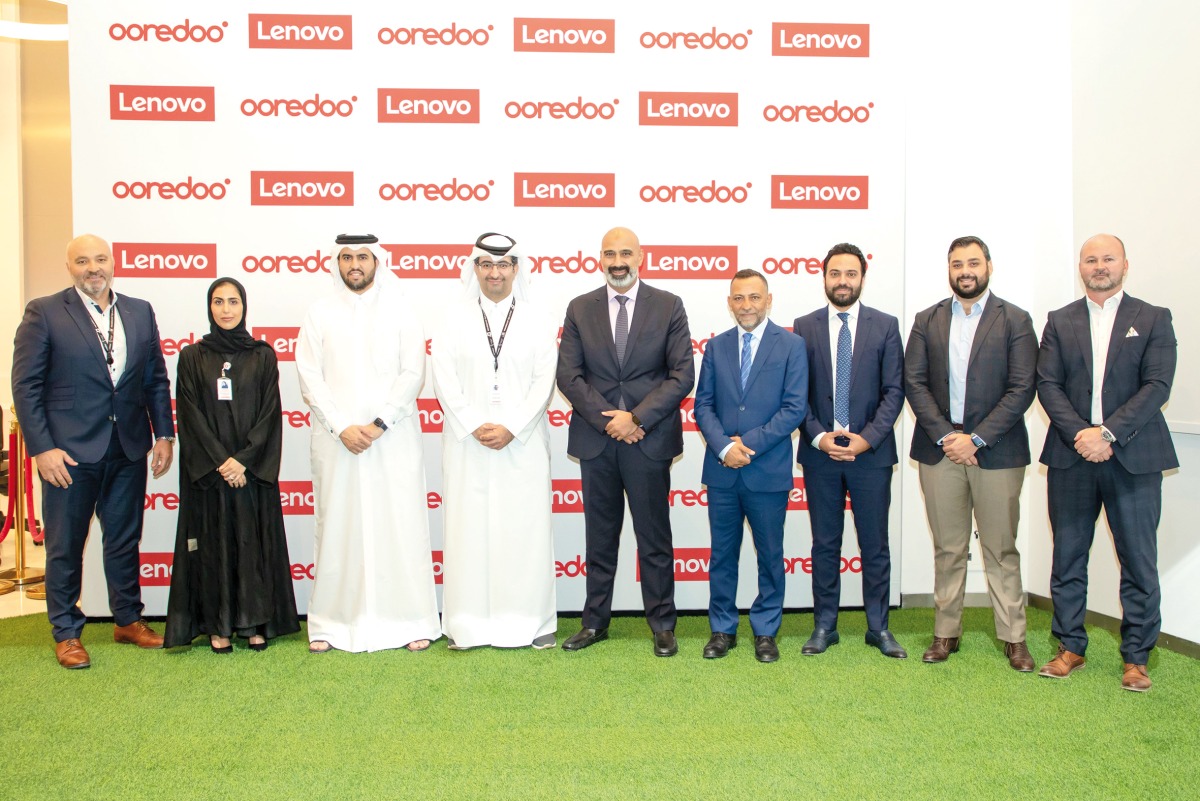 Ooredoo and Lenovo officials pose for a photograph after signing the MoU. 