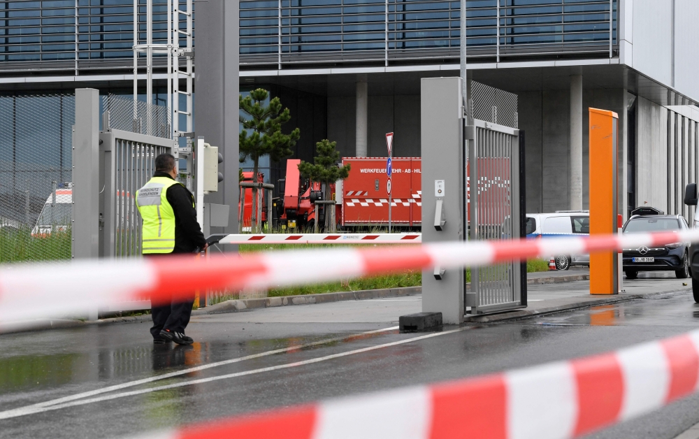 The area around the Factory 56 at the plant of German car maker Mercedes-Benz in Sindelfingen, southern Germany, is taped off after shots were fired at the plant on May 11, 2023. (Photo by Thomas Kienzle / AFP)