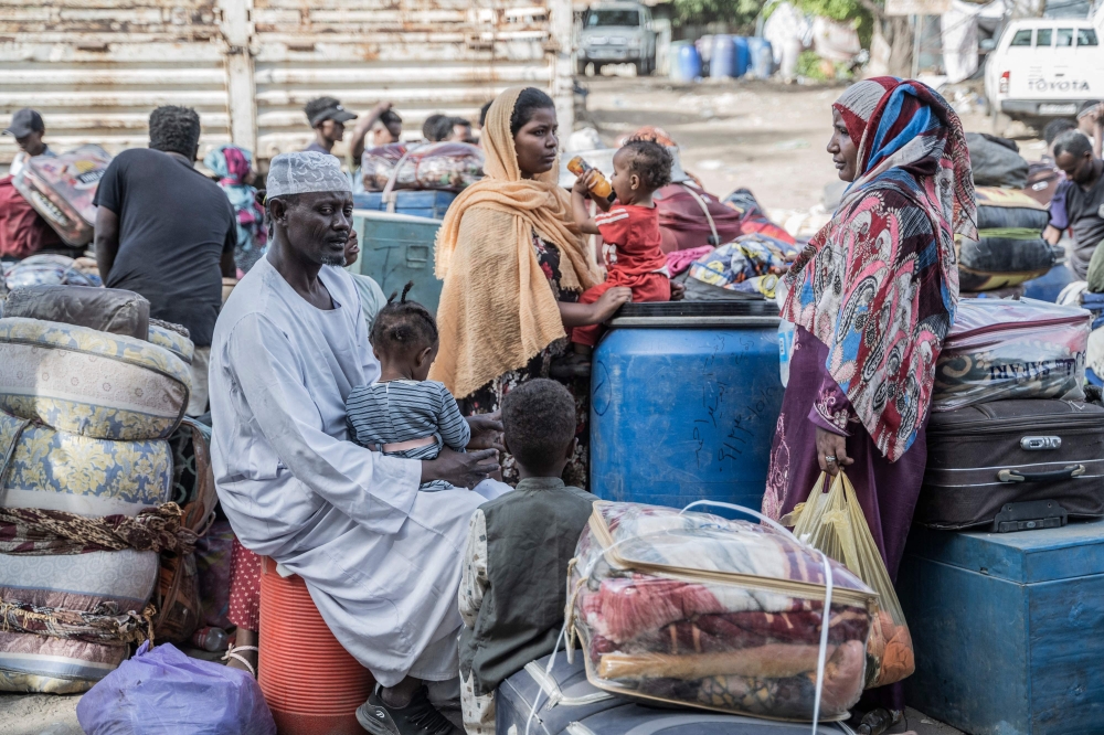 Refugees from Sudan who crossed into Ethiopia rest in Metema, on May 5, 2023. (Photo by Amanuel Sileshi / AFP)