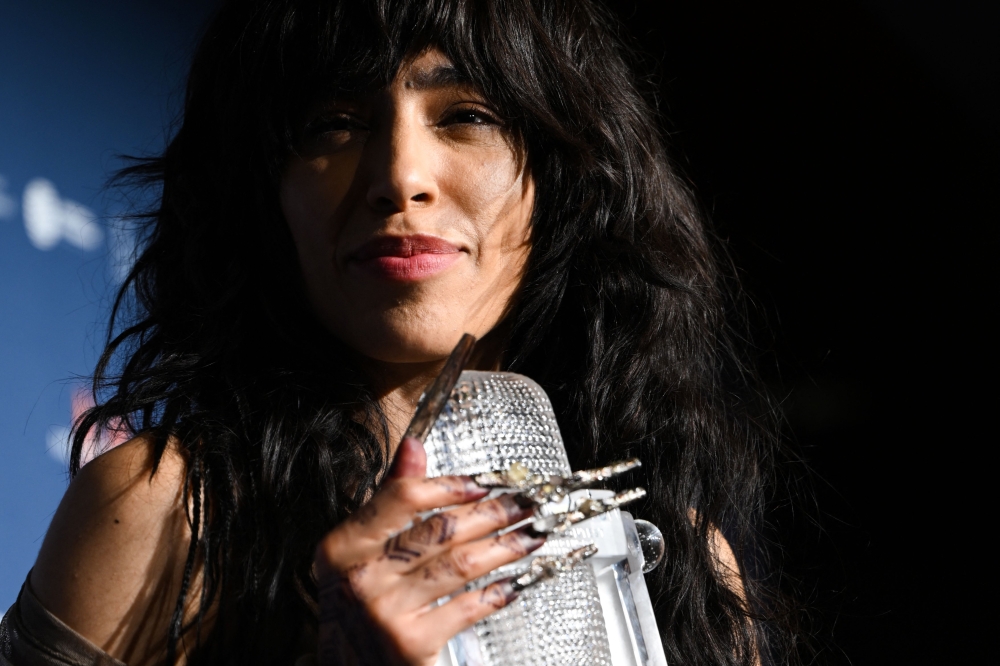 Singer Loreen performing on behalf of Sweden poses with the trophy after winning the final of the Eurovision Song contest 2023 on May 14, 2023 at the M&S Bank Arena in Liverpool, northern England. (Photo by Oli Scarff / AFP)