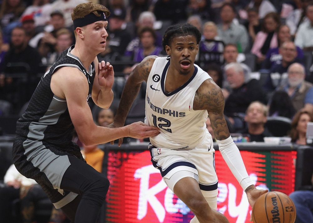 File photo: Ja Morant (R) seen in action with his team the Memphis Grizzlies. Lachlan Cunningham/ AFP