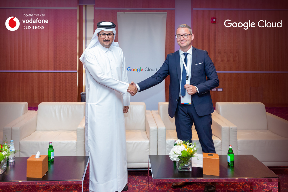 Officials shake hands at the launch event.