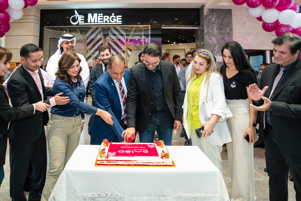 Daiso Japan officials cutting a cake at the opening of new branch in Ezdan Mall.