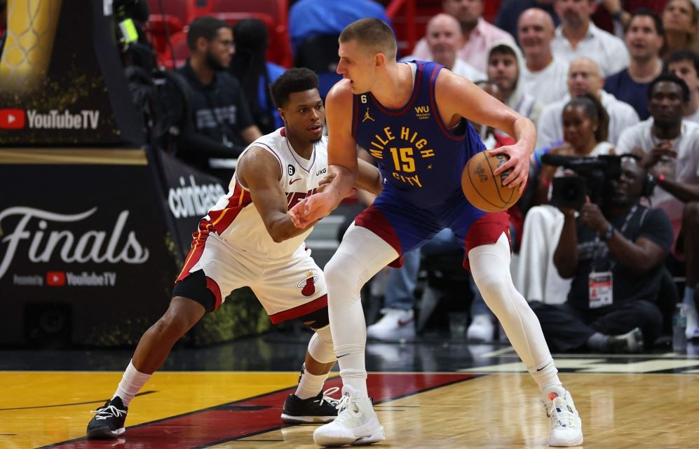 MIAMI, FLORIDA - JUNE 07: Nikola Jokic #15 of the Denver Nuggets dribbles against Kyle Lowry #7 of the Miami Heat during the third quarter in Game Three of the 2023 NBA Finals at Kaseya Center on June 07, 2023 in Miami, Florida. (Photo by Mike Ehrmann / GETTY IMAGES NORTH AMERICA / Getty Images via AFP)