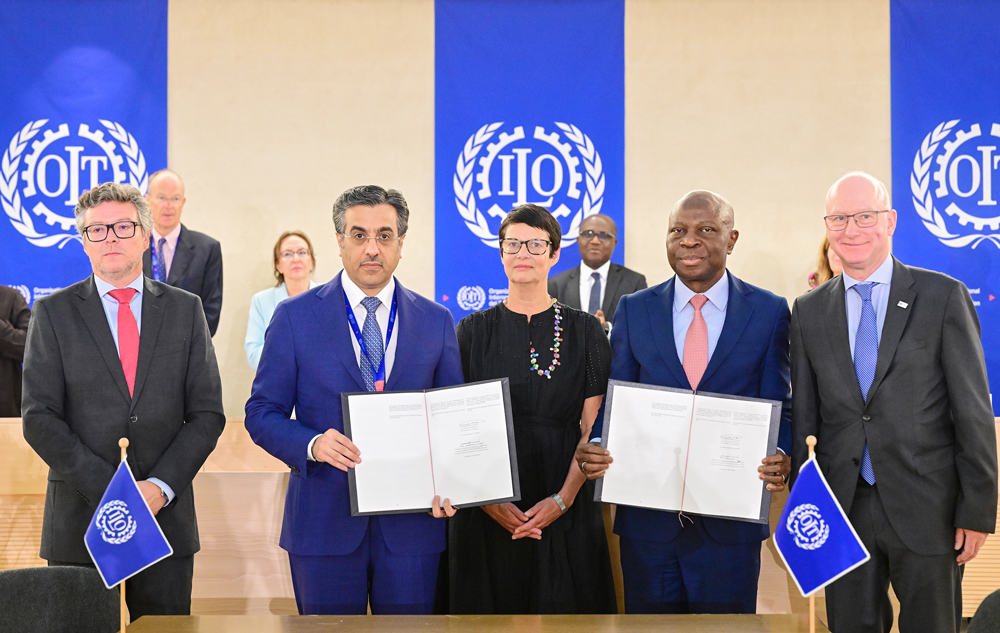 Minister of Labour and President of the International Labour Conference H E Dr. Ali bin Smaikh Al Marri (second left) and Director-General of the International Labour Organisation H E Gilbert Houngbo (second right) during the signing of memorandum of adoption.