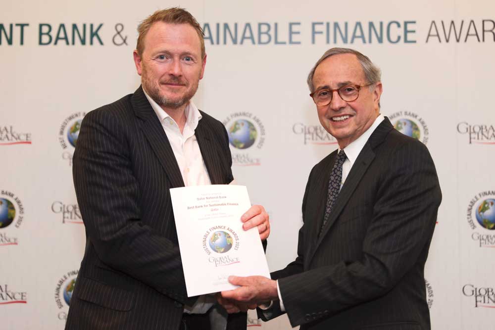 A QNB official receiving the award in London, recently.