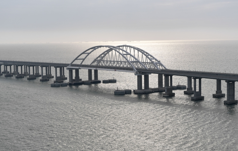 (Files) This picture taken on December 23, 2019, shows the Crimean Bridge that spans the Kerch Strait, a narrow strip that links the Azov and Black seas. (Photo by Alexey Nikolsky / AFP)