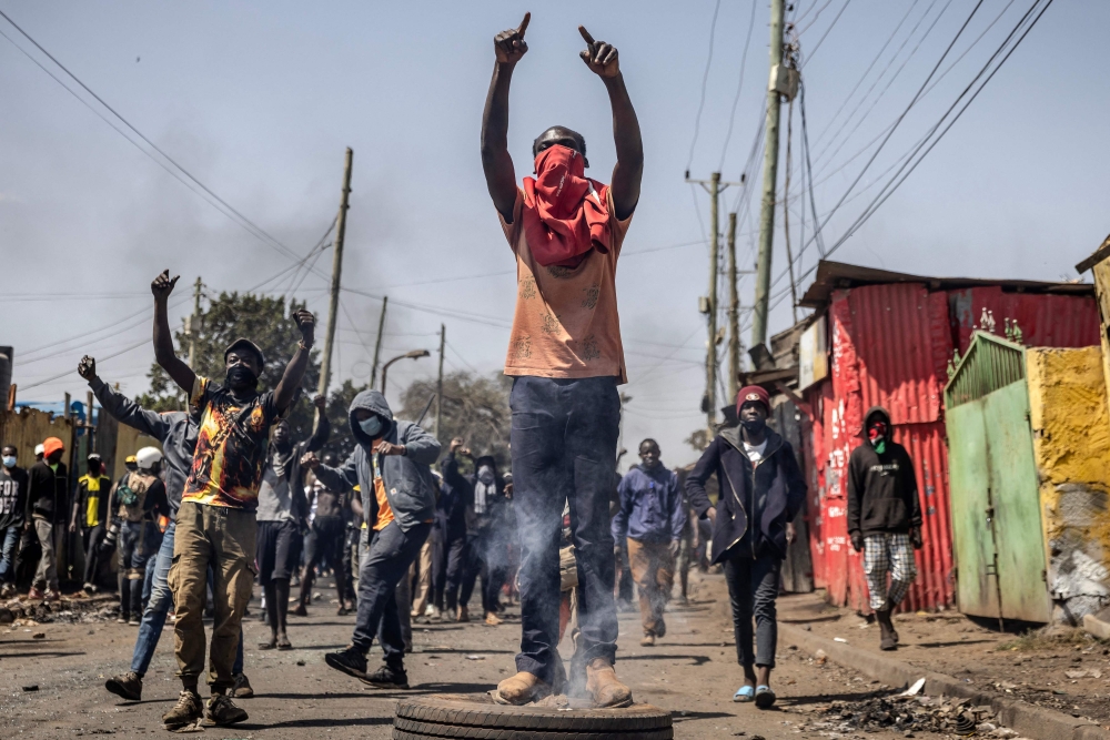 Opposition supporters gather and chant slogans during clashes with Kenya Police Officers on the third day of anti-government protests in Nairobi, Kenya on July 21, 2023. (Photo by Luis Tato / AFP)
