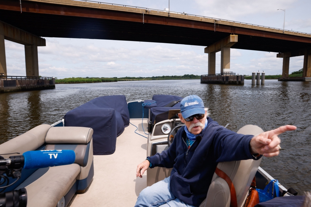 Activist and Captain Bill Sheehan speaks as he drives his boat along the Hackensack River in Secaucus, New Jersey, on June 15, 2023. (Photo by Kena Betancur / AFP)