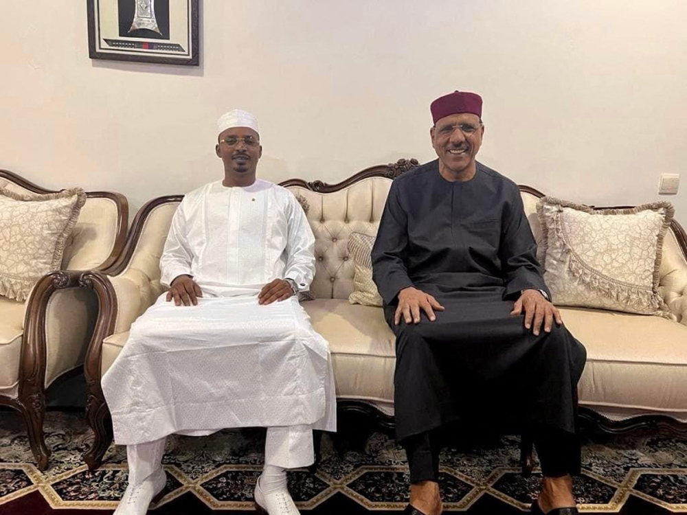 This image obtained from the Facebook page of the president of Chad, General Mahamat Idriss Deby Itno, shows him meeting with ousted Niger President Mohamed Bazoum in Niamey on July 30, 2023. (Photo by FACEBOOK / AFP)