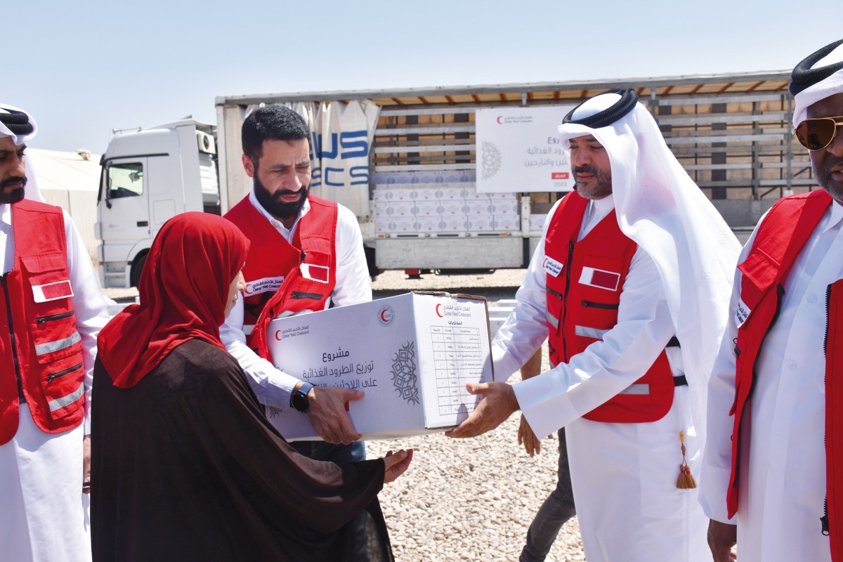 QRCS officials during the food distributing at Hasansham U2 Camp, Ninewa,  in Iraq.