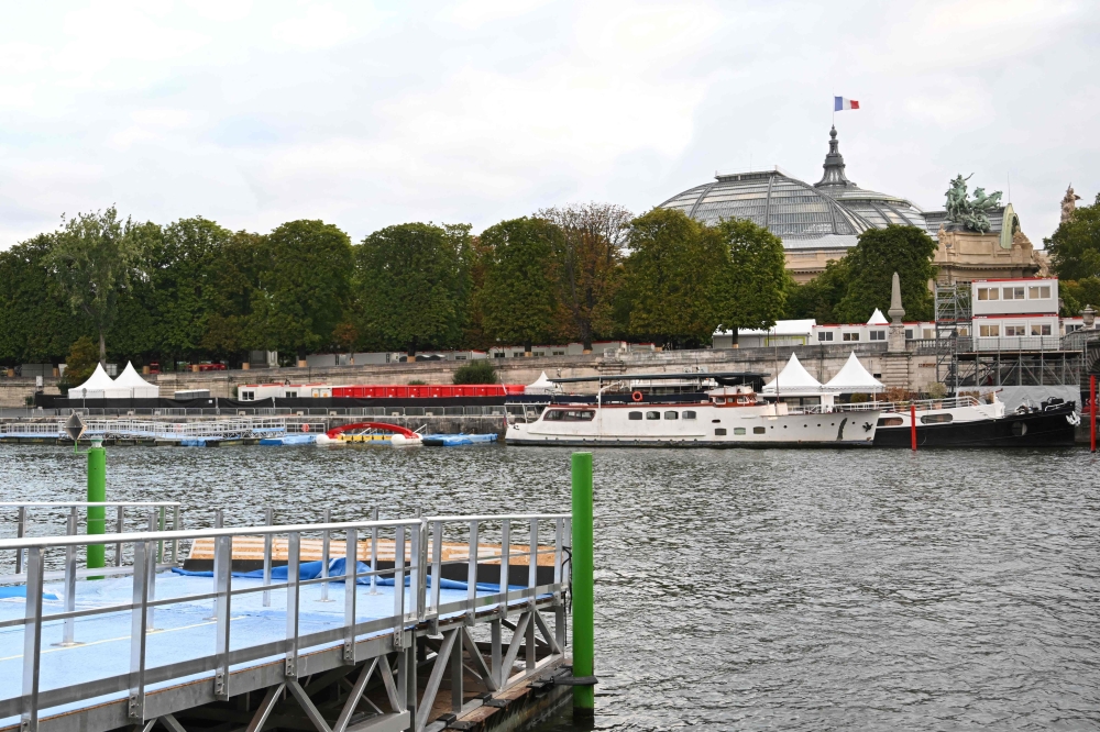 This photograph taken on August 6, 2023 shows the tempory venue to host a pre-Olympic swimming test competition on the river Seine in Paris. Photo by Bertrand GUAY / AFP
