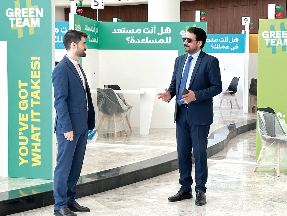 Pakistan Ambassador to Qatar H E Muhemmed Aejaz (left) with an official during the visit.