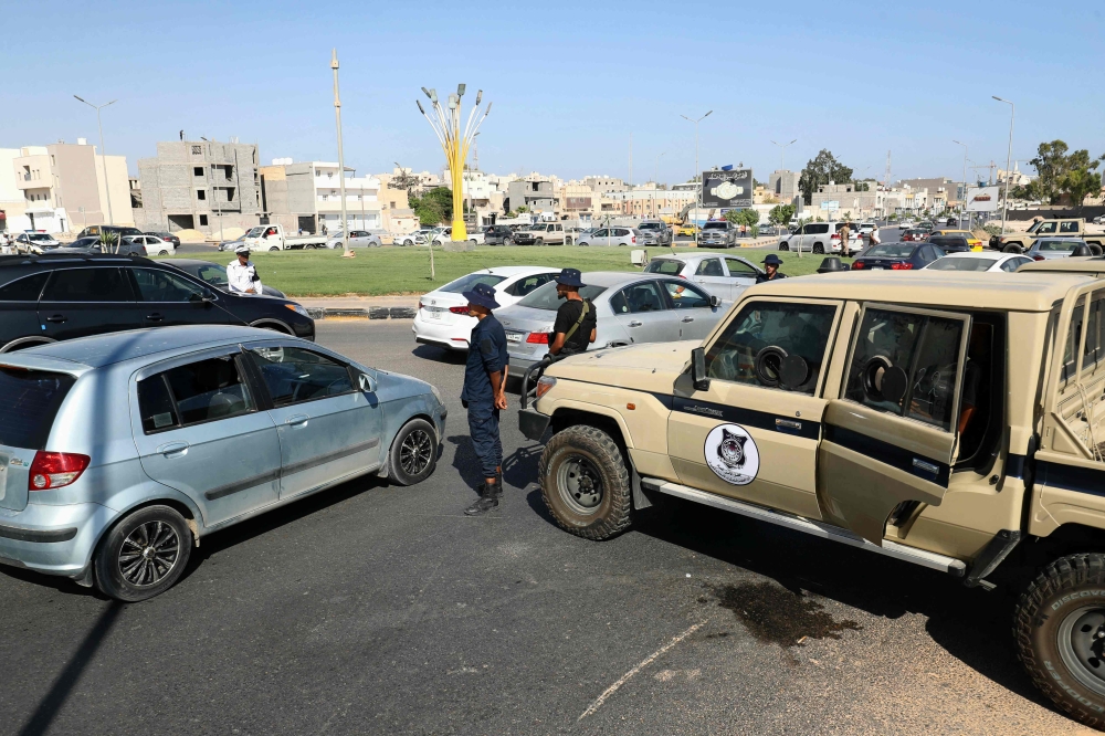 Forces affiliated with the Tripoli-based Government of National Unity (GNU) deploy following two days of deadly clashes between two rival groups in Libya's capital, on August 16, 2023. (Photo by Mahmud Turkia / AFP)