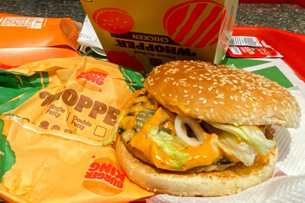 A sandwich without the usual slices of tomatoes is pictured at a Burger King outlet in New Delhi on August 17, 2023. Photo by Arun SANKAR / AFP