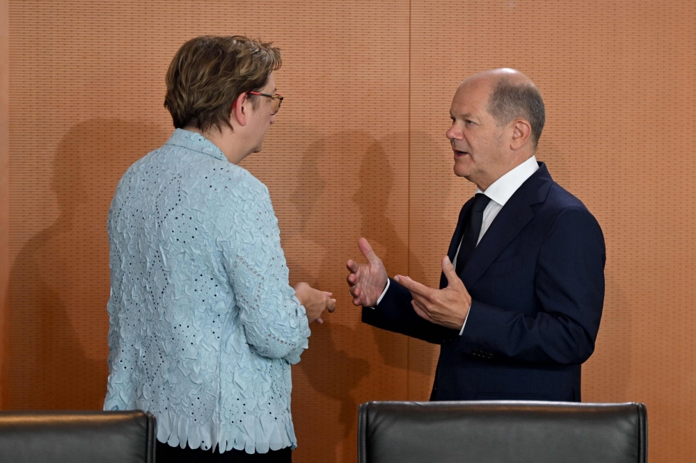German Chancellor Olaf Scholz (R) talks with German Minister for Housing, Urban Development and Building Klara Geywitz as they resume the weekly cabinet meeting after a summer break, on August 23, 2023 at the Chancellery in Berlin. Photo by John MACDOUGALL / AFP