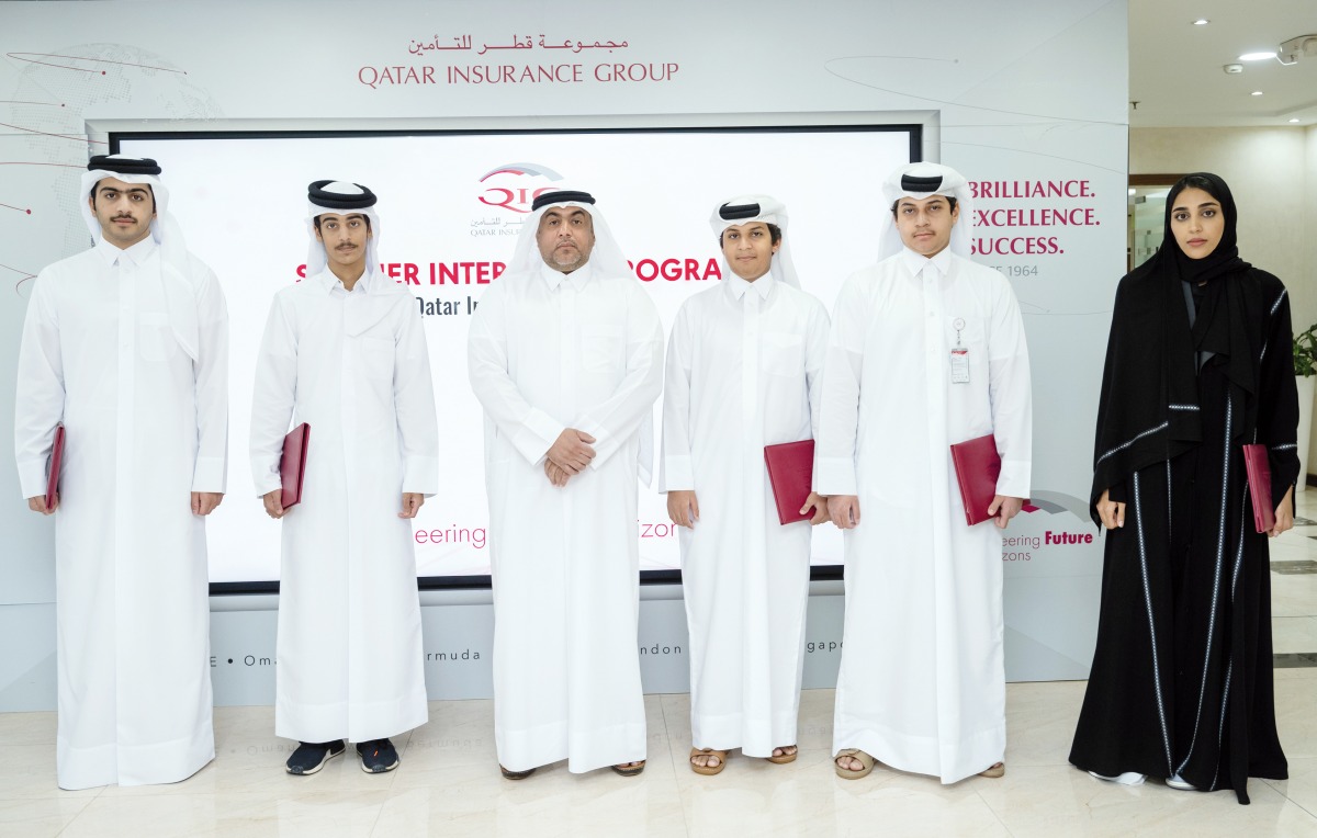 QIC Group Chief Administrative Officer, Rashid Al Buainain (third left) with students during the conclusion of Summer Internship Program, yesterday.