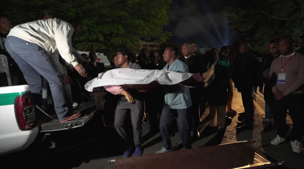 This videograb shows a body being brought to hospital in Antananarivo on August 25, 2023 following a stampede at a stadium.