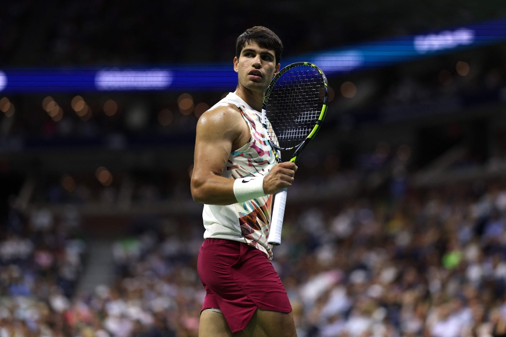 Carlos Alcaraz of Spain reacts against Lloyd Harris of South Africa during their Men's Singles Second Round match on Day Four of the 2023 US Open at the USTA Billie Jean King National Tennis Center at USTA Billie Jean King National Tennis Center on August 31, 2023 in the Flushing neighborhood of the Queens borough of New York City. Matthew Stockman/Getty Images/AFP