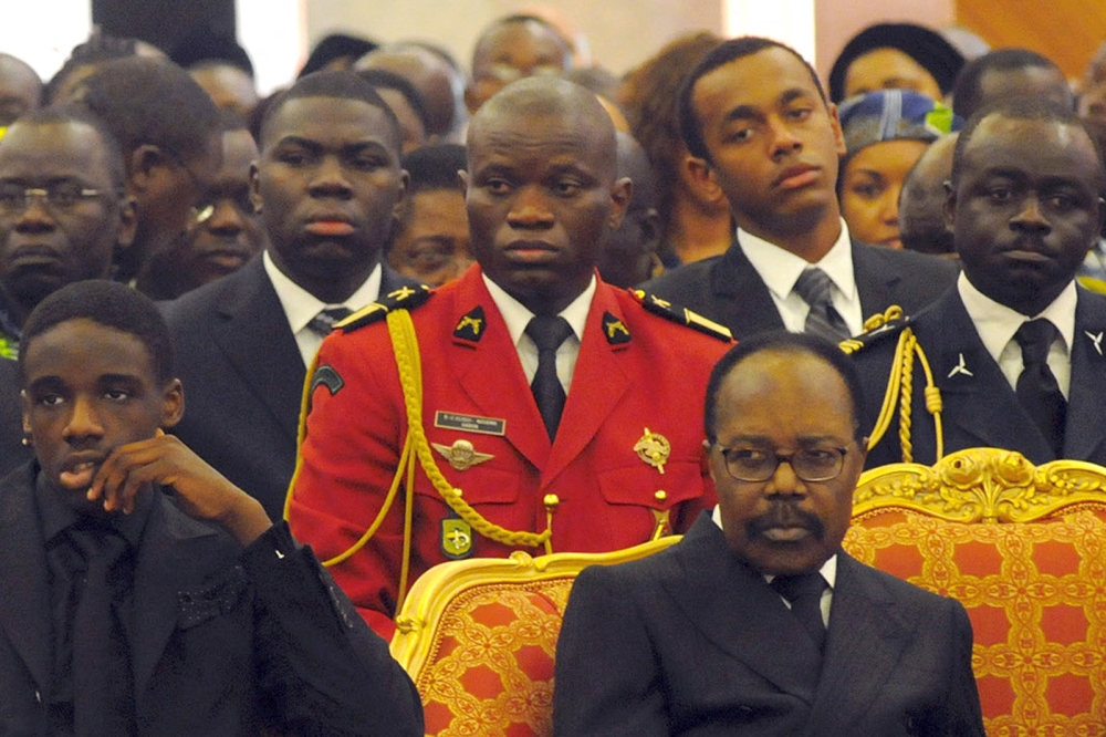 File photo: Omar Bongo Ondimba, Gabon's President (right) and General Brice Oligui Nguema (2nd row centre) attend the funeral of Gabon's first lady, Edith Lucie Bongo, in the Presidential Palace in Libreville on March 19, 2009. (Photo by WILS YANICK MANIENGUI / AFP)