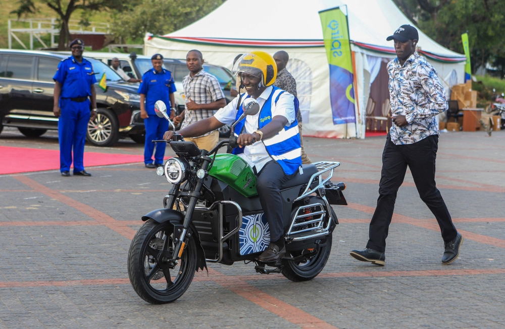 Kenya's President William Ruto uses an electric motorcycle during the national launch of an electric motorcycle project dubbed e-bodaboda at Kenyan Coastal city of Mombasa on September 1, 2023.(Photo by AFP)