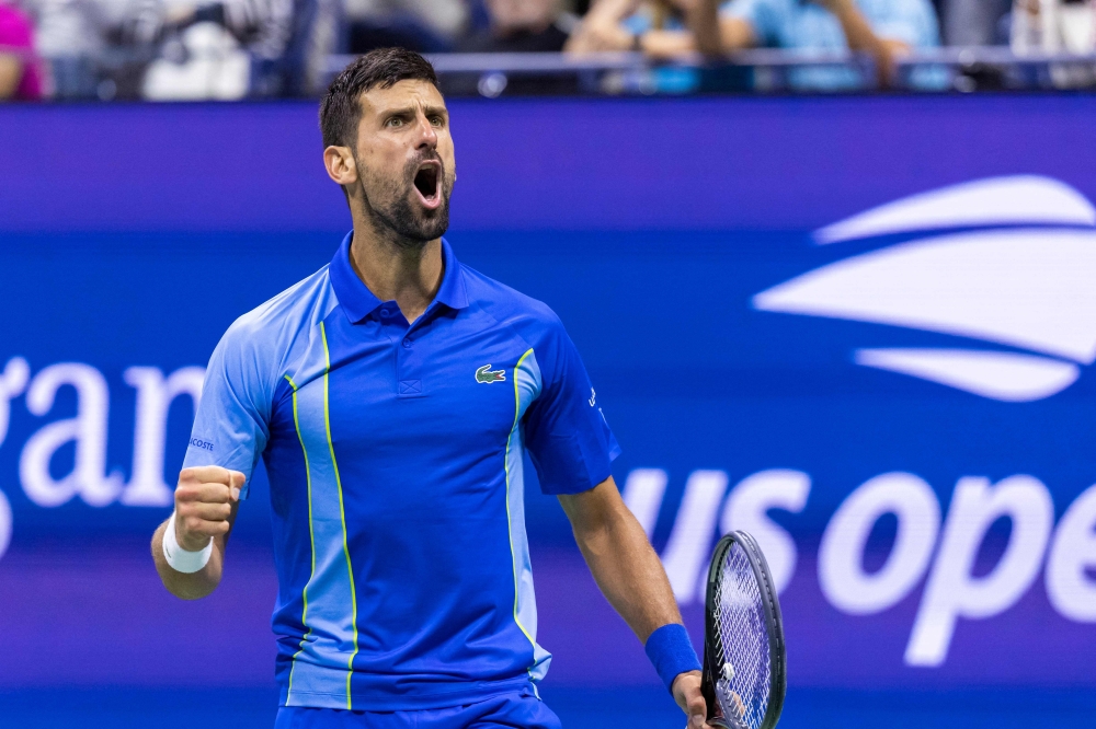 Serbia's Novak Djokovic reacts during his US Open tennis tournament men's singles third round match against Serbia's Laslo Djere at the USTA Billie Jean King National Tennis Center in New York City, on September 1, 2023. (Photo by Corey Sipkin / AFP)
 