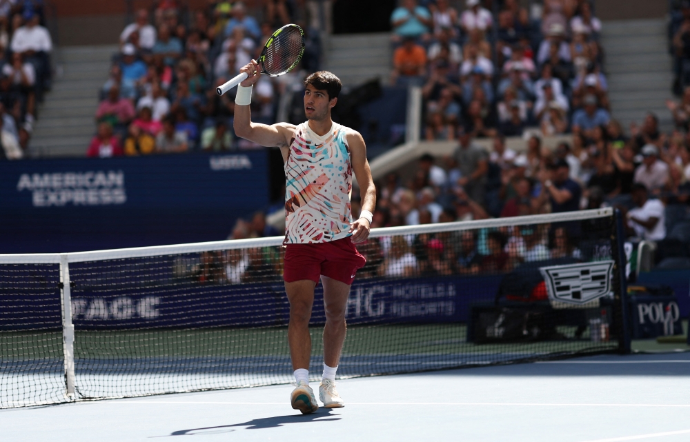 Carlos Alcaraz of Spain reacts against Daniel Evans of Great Britain during their Men's Singles Third Round match. CLIVE BRUNSKILL /Getty Images via AFP
