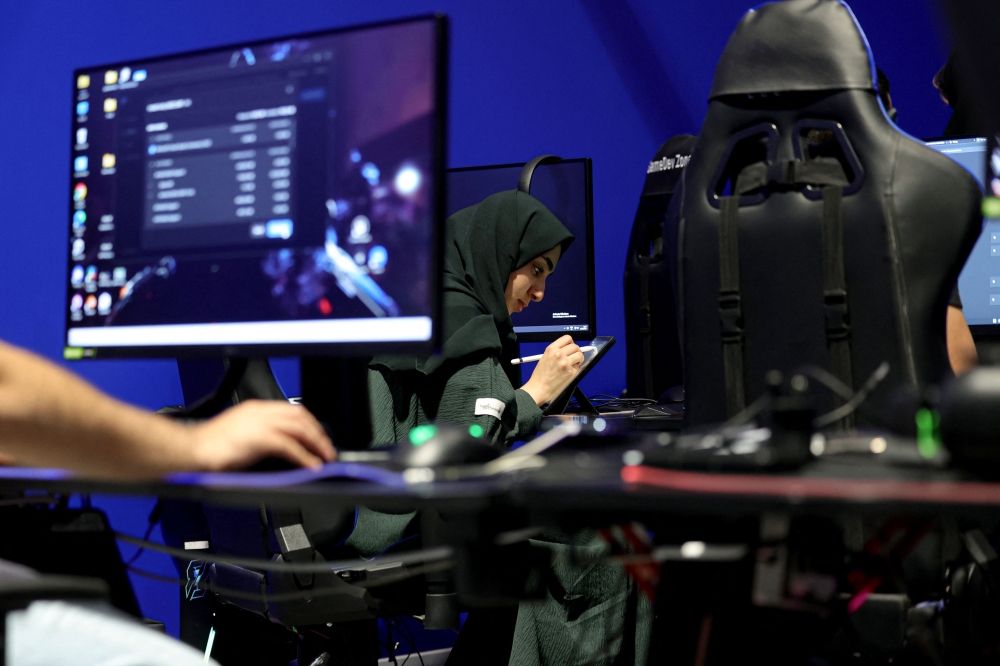 A Saudi trainee attends a training course at the Saudi Esport Academy in Riyadh on August 29, 2023. (Photo by Fayez Nureldine / AFP)