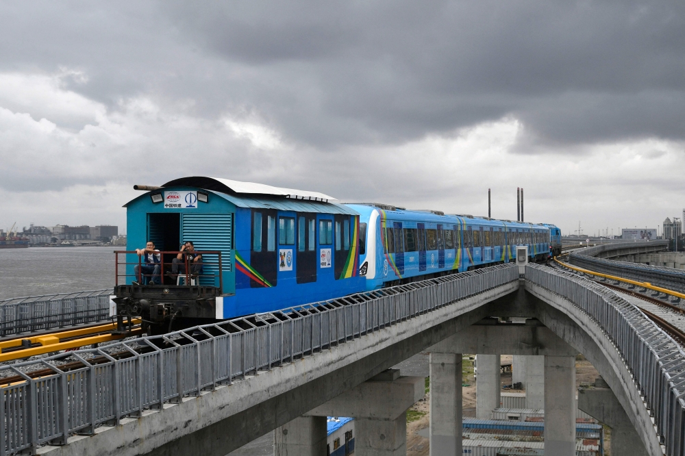 The Lagos Blue Line rail arrives at the Marina station during the inauguration of commercial operation of the mass transit in Lagos on September 4, 2023. (Photo by Pius Utomi Ekpei / AFP)
