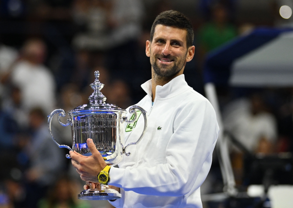 Serbia's Novak Djokovic poses with the trophy after defeating Russia's Daniil Medvedev in the US Open tennis tournament men's singles final match at the USTA Billie Jean King National Tennis Center in New York on September 10, 2023. (Photo by ANGELA WEISS / AFP)
