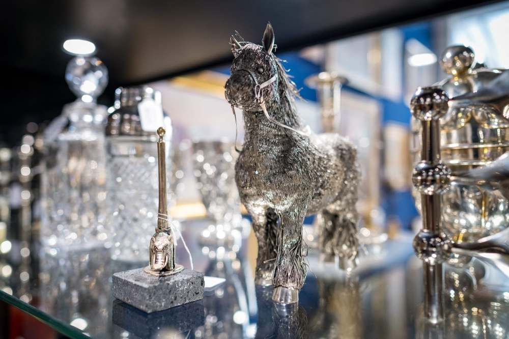 A silver pony expected to fetch between 400 and 600 Swiss francs ($450-$670) is displayed ahead of sales at Geneve Encheres auction house, in Geneva on September 8, 2023. (Photo by Fabrice Coffrini / AFP)
 