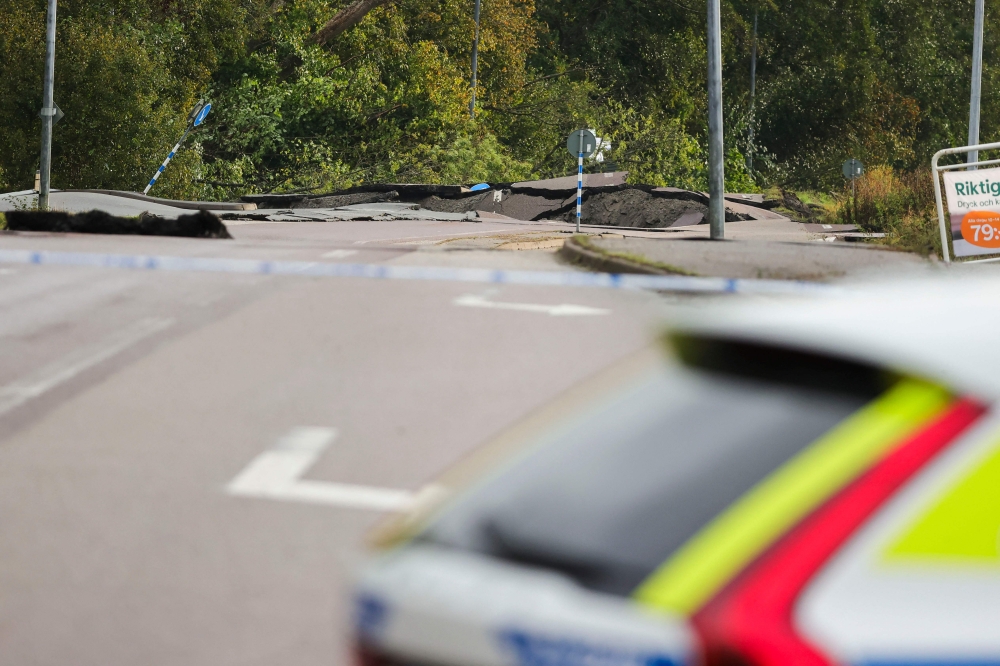 A destroyed street is seen near Stenungsund, Sweden, on September 23, 2023. (Photo by Adam IHSE / TT News Agency / AFP)