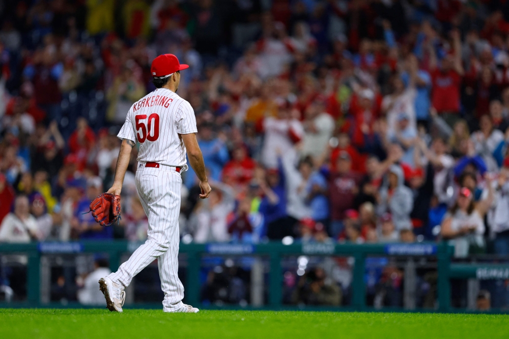 Orion Kerkering #50 of the Philadelphia Phillies walks off the mound after pitching a scoreless eighth inning in his major league debut against the New York Mets at Citizens Bank Park on September 24, 2023 in Philadelphia, Pennsylvania. (Photo by Rich Schultz / GETTY IMAGES NORTH AMERICA / Getty Images via AFP)

