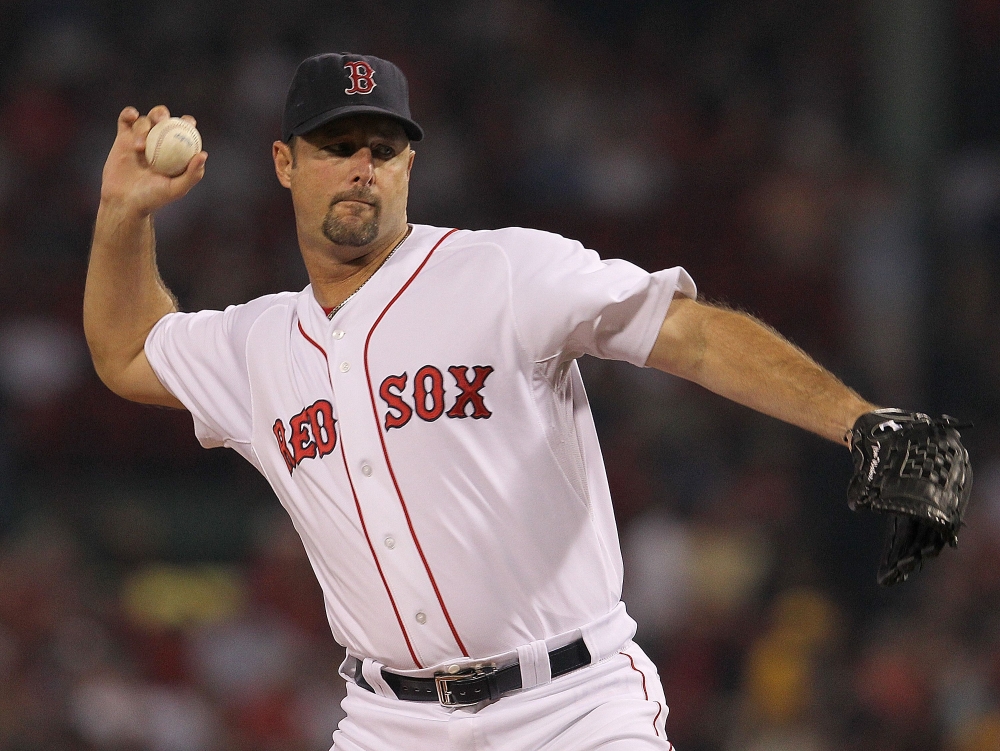 Tim Wakefield, #49 of the Boston Red Sox, throws against the Toronto Blue Jays at Fenway Park in Boston, Massachusetts, on September 13, 2011. (Photo by Jim Rogash / GETTY IMAGES NORTH AMERICA / AFP)
