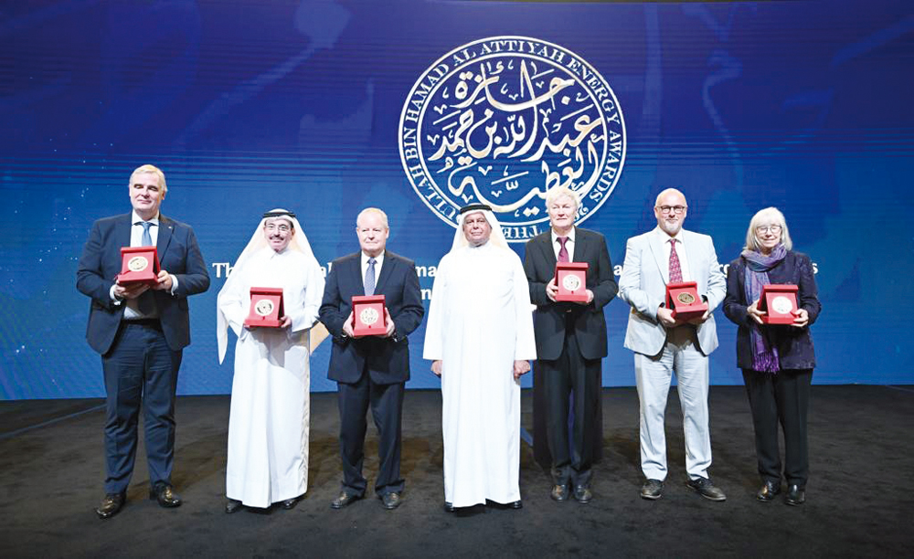 Former Minister of Energy and Industry H E Abdullah bin Hamad Al Attiyah with the winners of this year's Al Attiyah International Lifetime Energy Awards, during the ceremony of honouring winners at the Sheraton Grand Doha Resort & Convention Hotel, yesterday.